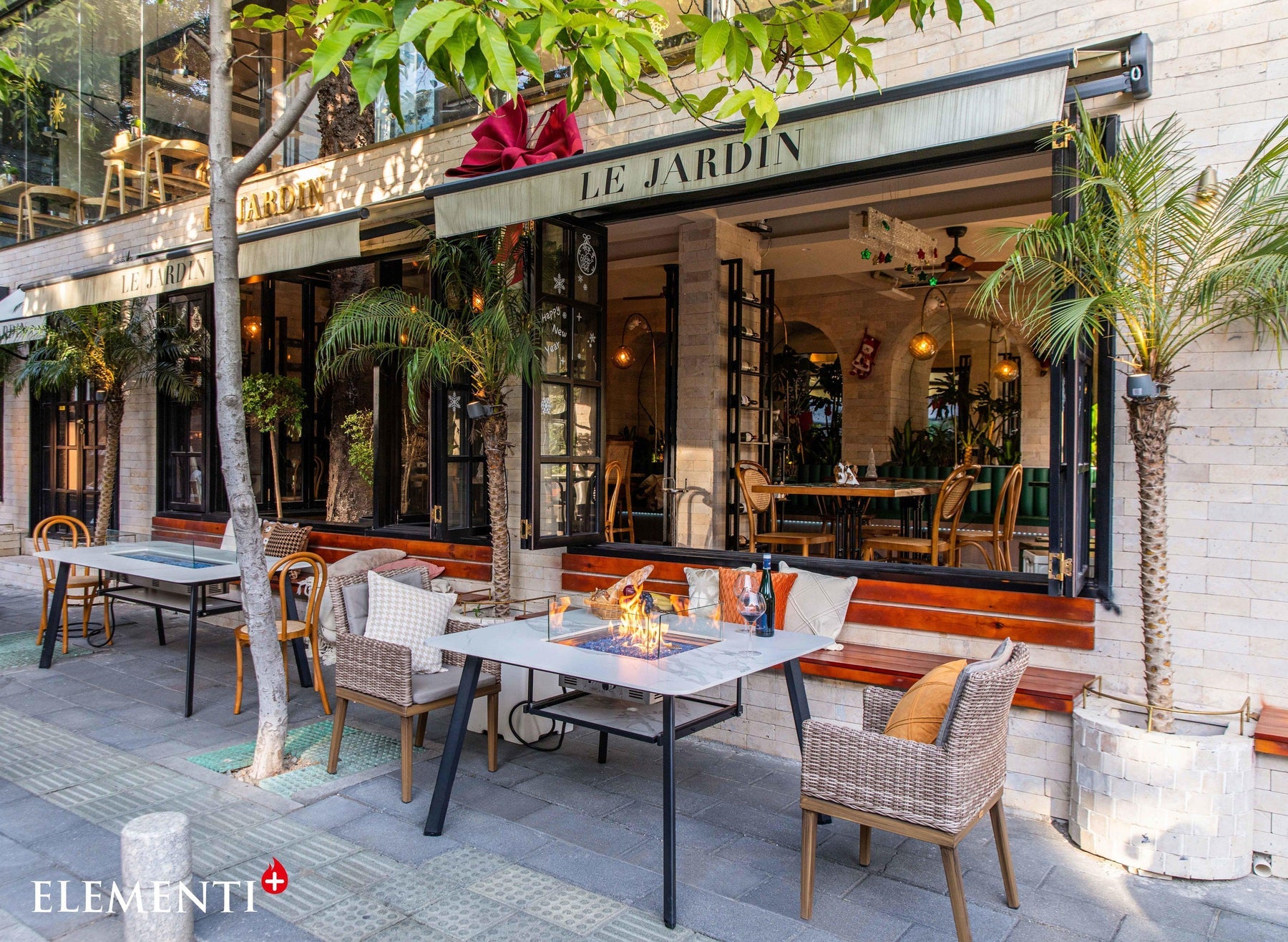 Elementi Plus Helsinki outdoor dining with fire feature