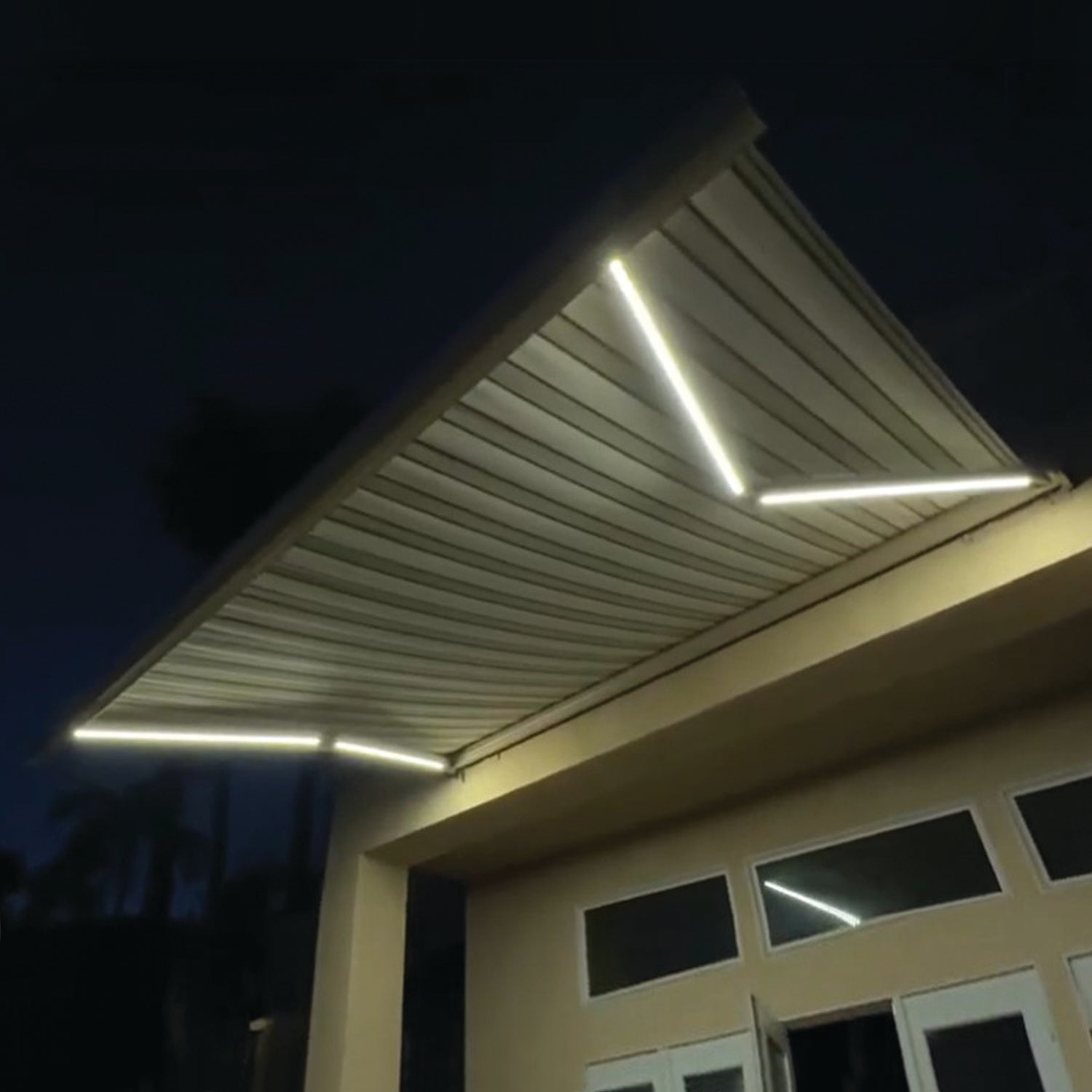 Advaning Prestige Pro retractable awning with integrated LED lights on outdoor patio